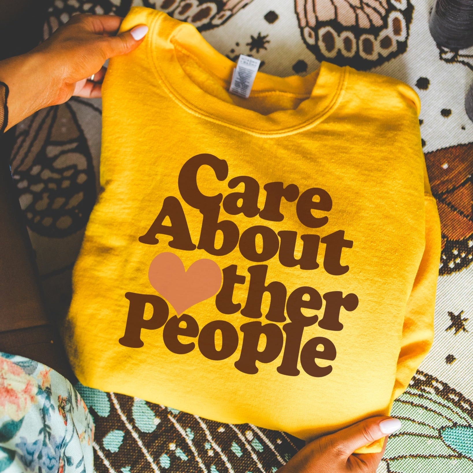 Care about other people sweatshirt in gold