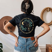 Model wearing a black t shirt that reads when injustice becomes law resistance becomes duty