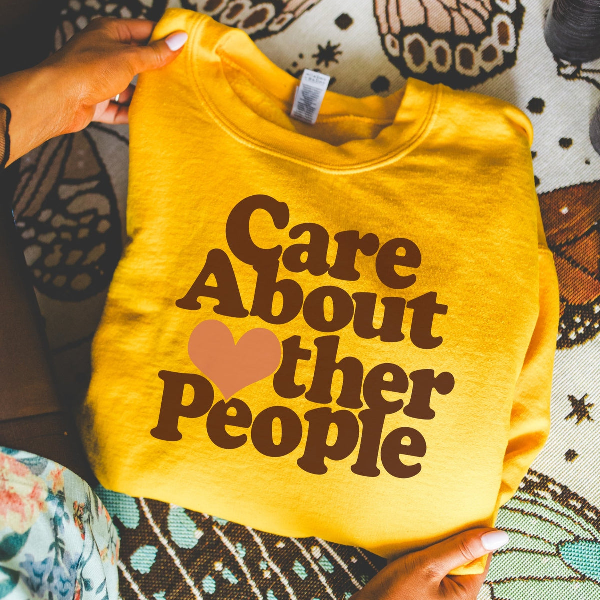 Care about other people sweatshirt in gold
