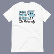 Flat lay of a white t-shirt on a neutral background. The shirt features a bold phrase that reads “Drink Water and Fight the Patriarchy” alongside an animated illustration of a smiling cup of water.