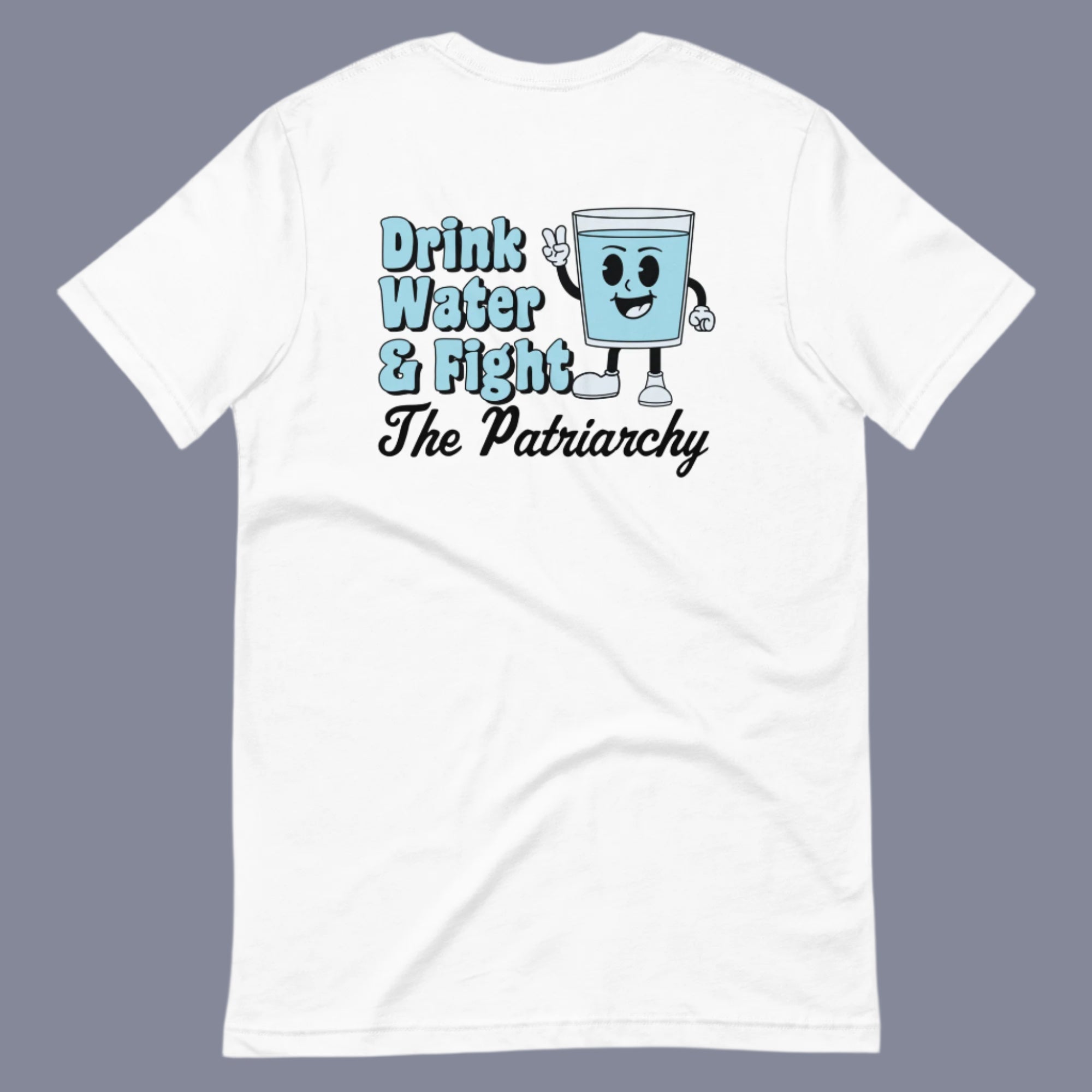 Flat lay of a white t-shirt on a neutral background. The shirt features a bold phrase that reads “Drink Water and Fight the Patriarchy” alongside an animated illustration of a smiling cup of water.