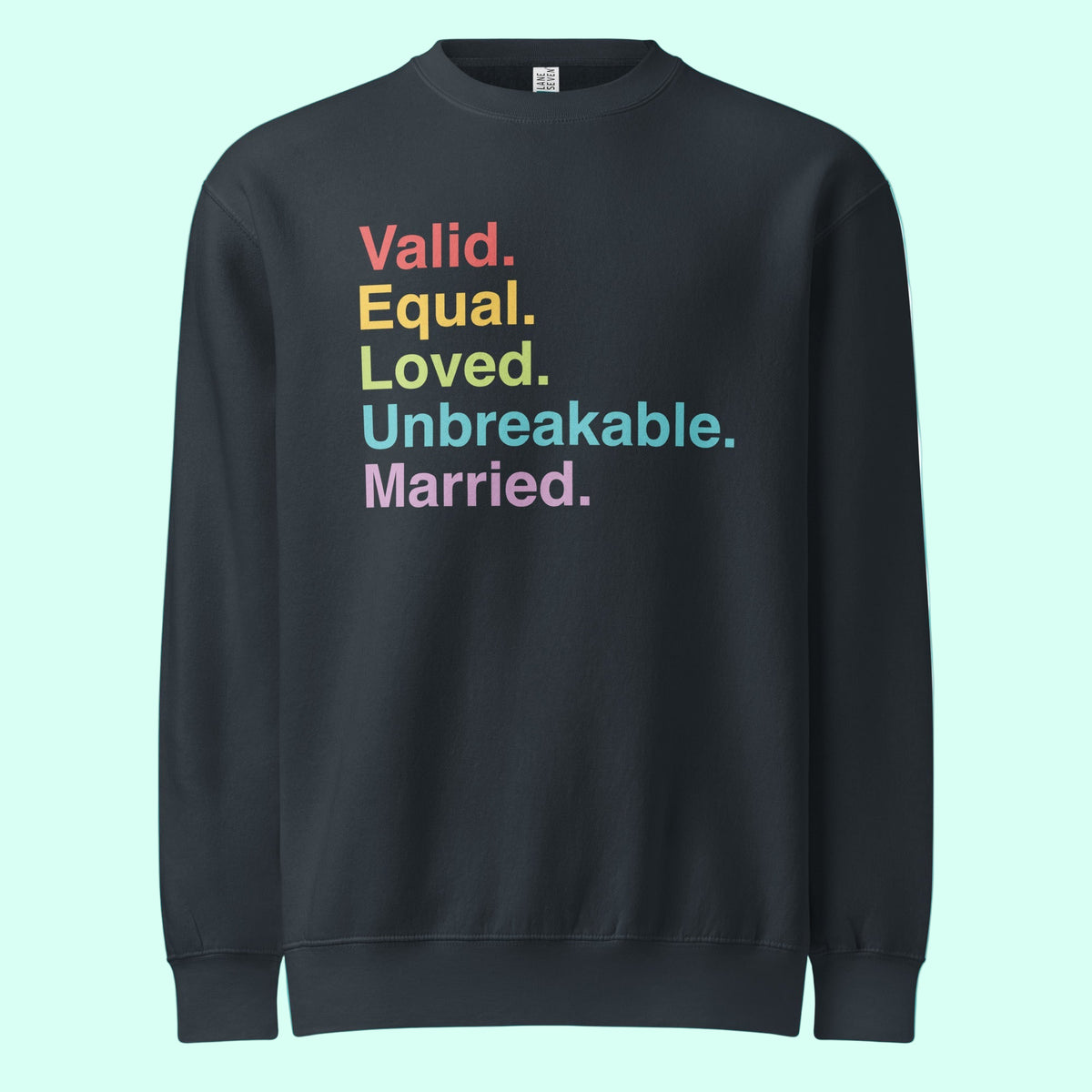 Navy sweatshirt with colorful text on a light blue background. The text reads "valid. equal. loved. unbreakable. married."