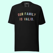 A Black T Shirt with colorful font that says "our family is valid" on a Light Blue Background