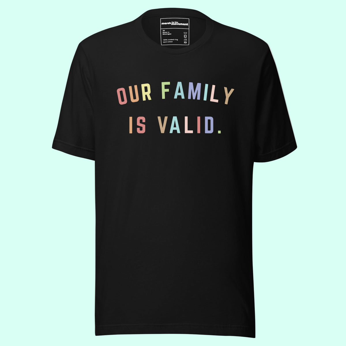 A Black T Shirt with colorful font that says "our family is valid" on a Light Blue Background