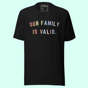A Black T Shirt with colorful font that says "our family is valid" on a Light Blue Background