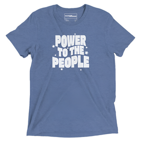 A light blue triblend material t shirt with light gray vintage faded text that reads "power to the people" 