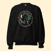 Mockup of a black sweatshirt with the phrase, "When injustice becomes law, resistance becomes duty."