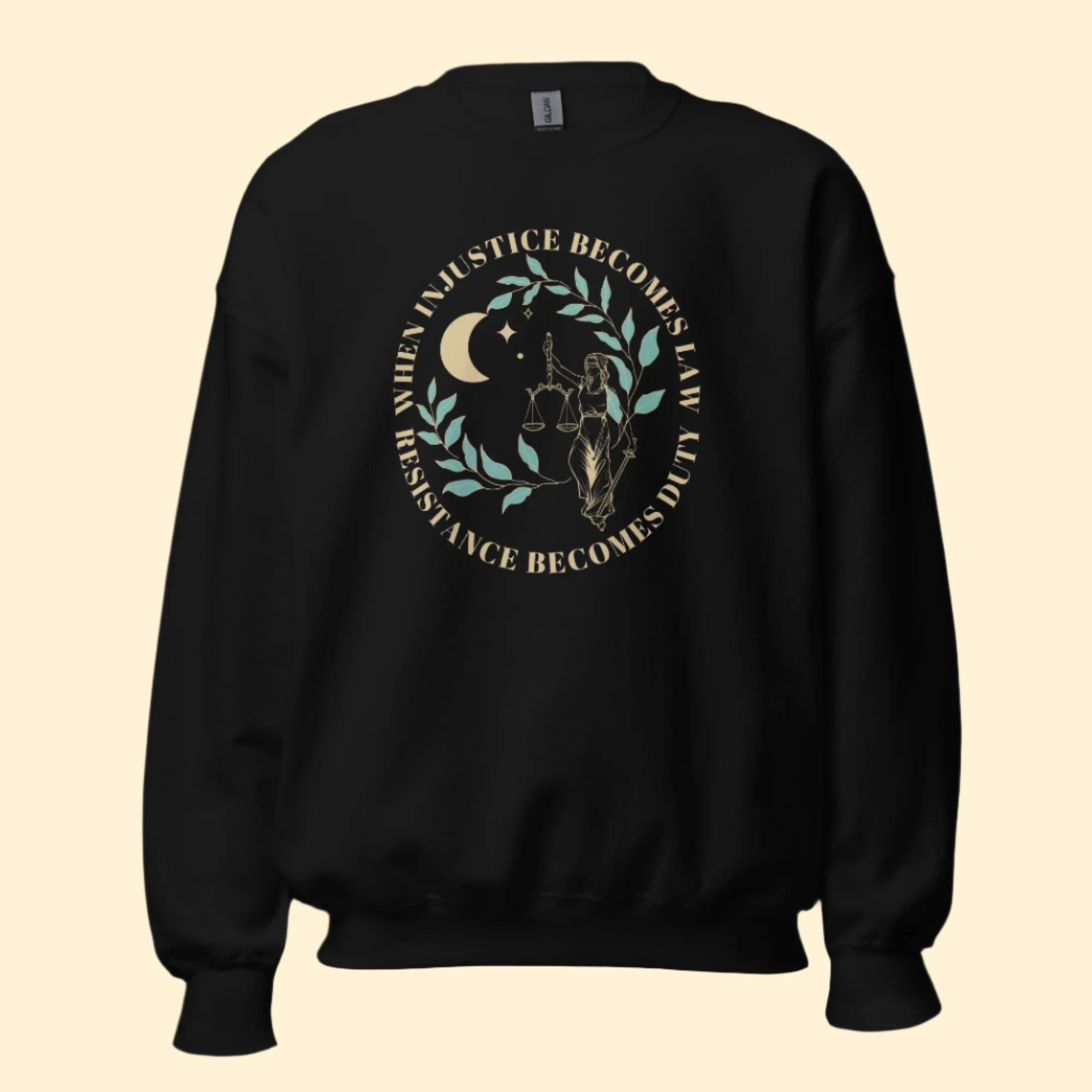 Mockup of a black sweatshirt with the phrase, "When injustice becomes law, resistance becomes duty."