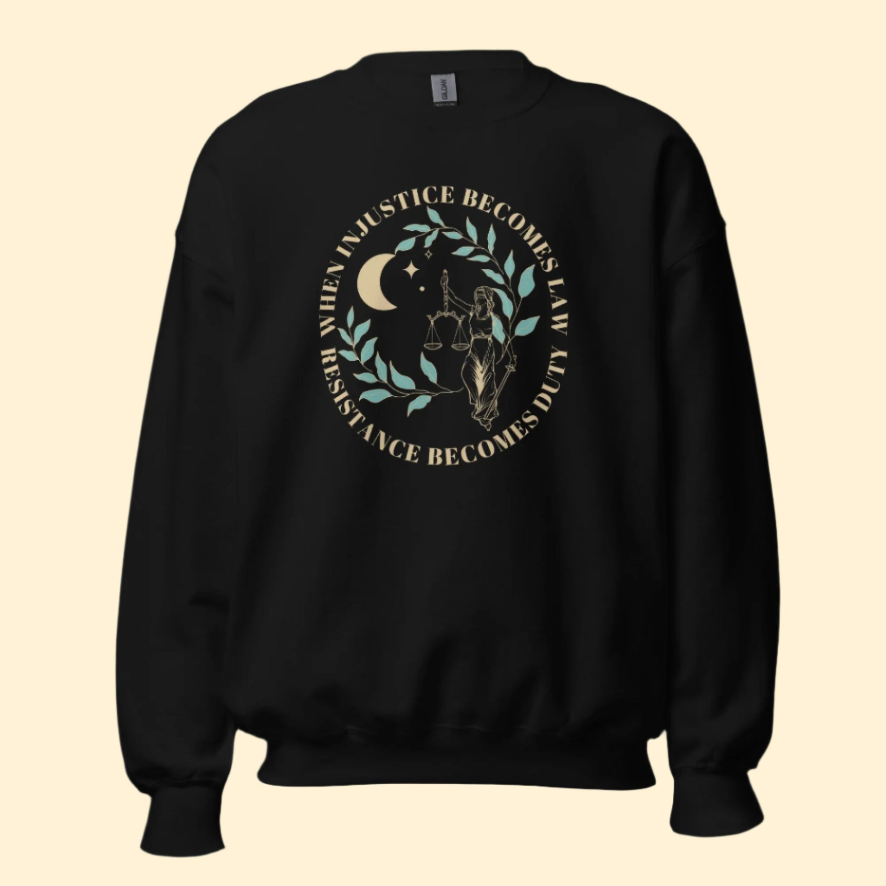 Mockup of a black sweatshirt with the phrase, "When injustice becomes law, resistance becomes duty."