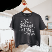 The President Is Lying to You - Women's Heavyweight Boxy Crop Tee