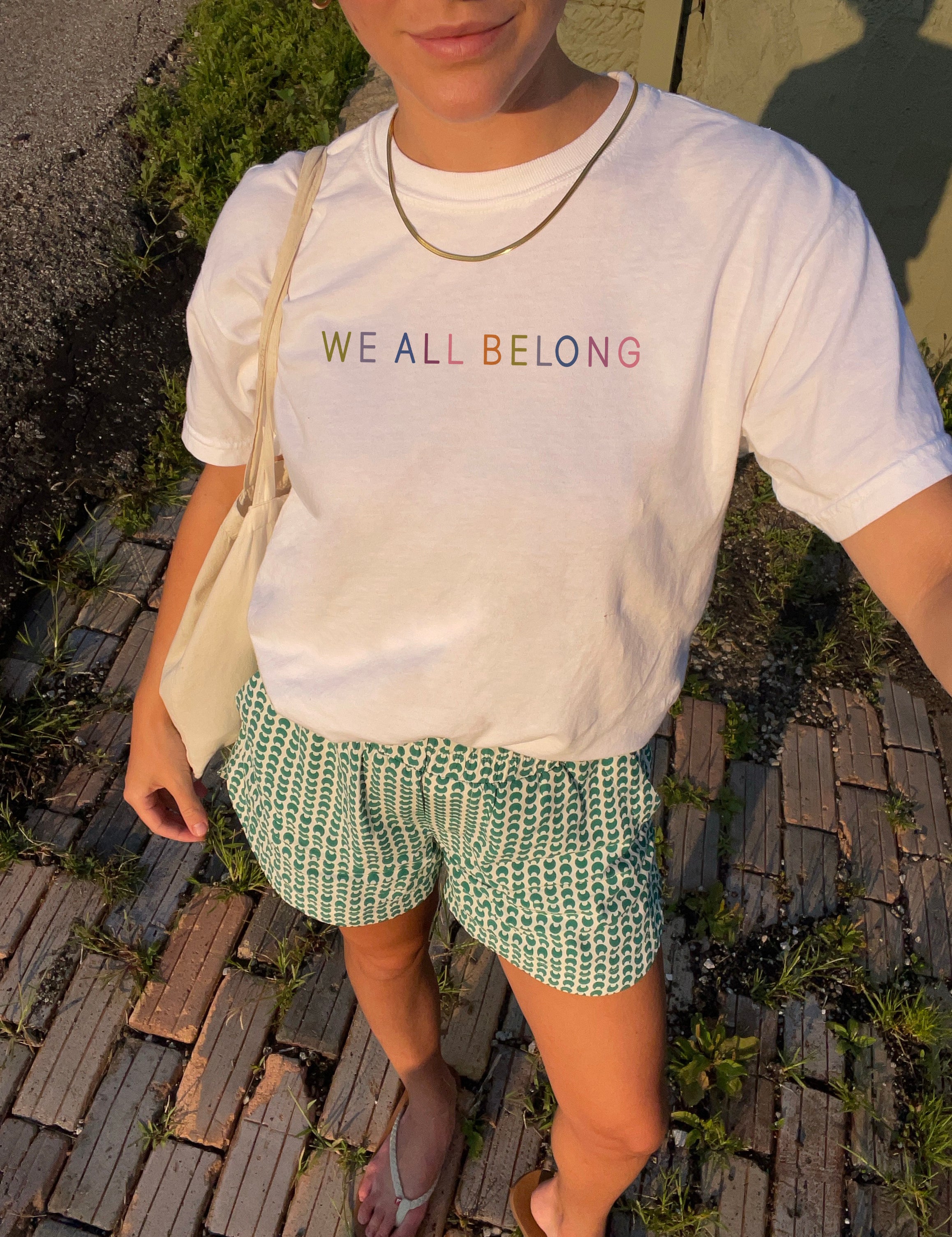 we_all_belong_white_t_shirt.jpg