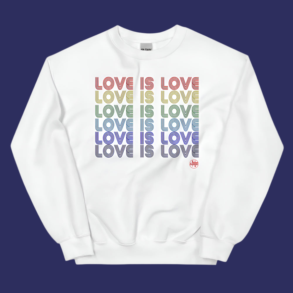 Flat lay of a white sweatshirt on a neutral background. The design features the phrase “Love is Love” repeated multiple times in multicolored vintage-style text across the chest, along with a March For The Movement logo.