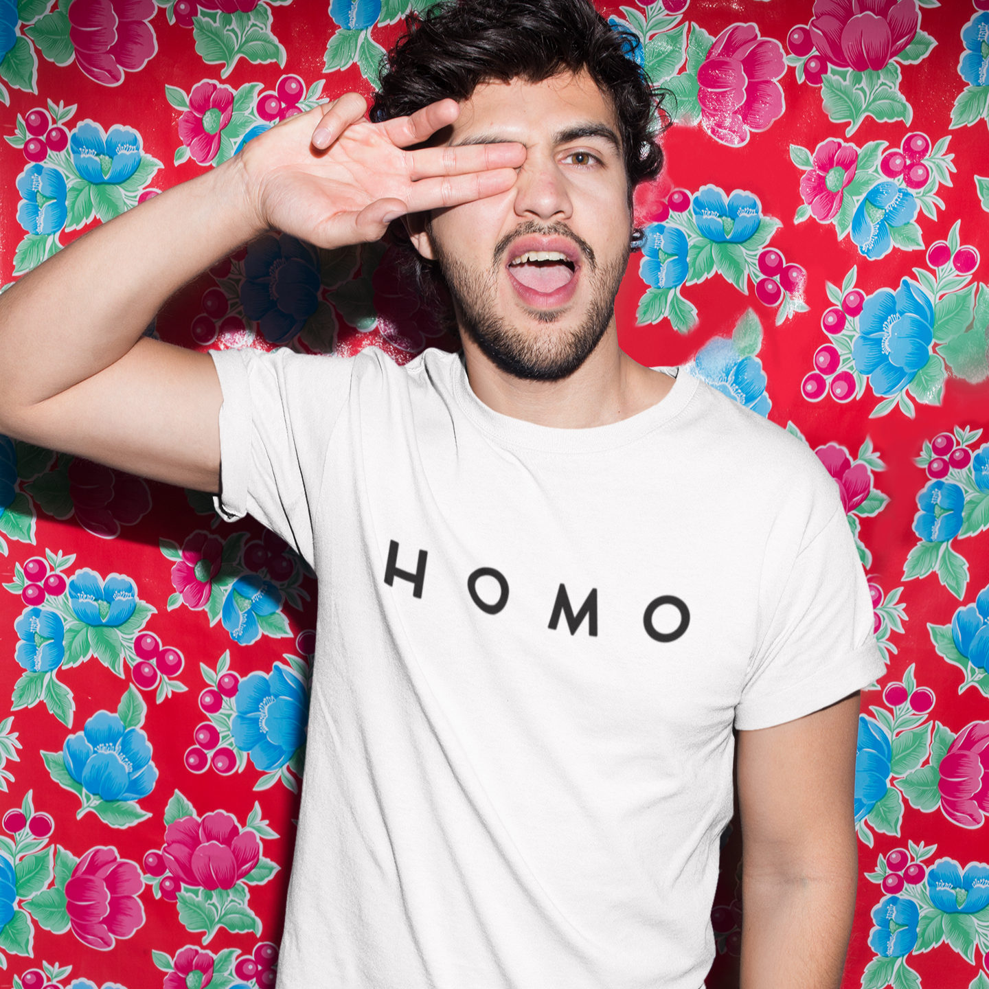 mockup-of-a-man-wearing-a-t-shirt-against-a-red-printed-plastic-tablecloth-18762.png
